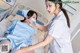 A nurse putting a mask on a patient's face.